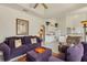 View of the living room leading to the kitchen with white cabinets and appliances at 604 Boundary Blvd, Rotonda West, FL 33947