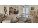 Inviting living room featuring neutral tones, tile flooring and large windows for natural light at 604 Boundary Blvd, Rotonda West, FL 33947