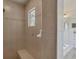 Walk-in shower and bathtub with white cabinets at 604 Boundary Blvd, Rotonda West, FL 33947