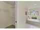 Walk-in closet and bathtub with a window view at 604 Boundary Blvd, Rotonda West, FL 33947