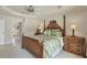 Cozy main bedroom with a decorative bed, lamps, and an adjacent bathroom at 604 Boundary Blvd, Rotonda West, FL 33947