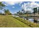 Scenic waterfront view with lush green grass at 604 Boundary Blvd, Rotonda West, FL 33947