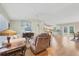 Open-concept living room flowing into a modern kitchen and dining area at 6125 Higgins Ln, Englewood, FL 34224