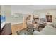 Spacious living room with open floor plan and wood floors at 6125 Higgins Ln, Englewood, FL 34224