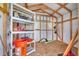 Inside of the shed features shelving and storage solutions at 6125 Higgins Ln, Englewood, FL 34224