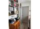 Hallway with storage and decorative shelves leading into the laundry room at 6383 Coniston St, Port Charlotte, FL 33981