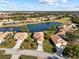 Property overview showcasing a house, lake, and surrounding neighborhood at 6730 Greenview Ln, Englewood, FL 34224
