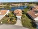 Single-Gathering home on a waterfront lot with tropical landscaping at 6730 Greenview Ln, Englewood, FL 34224