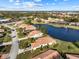 Community overview showcasing houses and a lake at 6730 Greenview Ln, Englewood, FL 34224