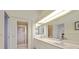 Bathroom with double vanity and walk-in shower at 6730 Greenview Ln, Englewood, FL 34224