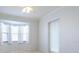 Bedroom with bay window and ceiling fan at 6730 Greenview Ln, Englewood, FL 34224
