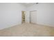Bright bedroom featuring neutral carpet and access to an ensuite bathroom at 6730 Greenview Ln, Englewood, FL 34224