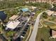 Community clubhouse with a large parking lot nearby at 6730 Greenview Ln, Englewood, FL 34224