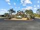 Community center with palm trees and a welcoming entrance at 6730 Greenview Ln, Englewood, FL 34224