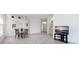 Bright dining area with seating for four and view to kitchen at 6730 Greenview Ln, Englewood, FL 34224