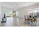 Dining room with chandelier and view of sunroom at 6730 Greenview Ln, Englewood, FL 34224