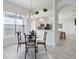 Bright dining area with a view into the kitchen at 6730 Greenview Ln, Englewood, FL 34224