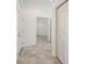 Clean entry hall with tile flooring, leading to other rooms at 6730 Greenview Ln, Englewood, FL 34224