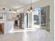 Spacious kitchen featuring stainless steel appliances and access to backyard at 6730 Greenview Ln, Englewood, FL 34224