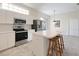 Kitchen with stainless steel appliances and island at 6730 Greenview Ln, Englewood, FL 34224