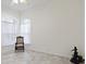 Spacious living room featuring hardwood floors and ample natural light at 6730 Greenview Ln, Englewood, FL 34224