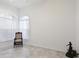 Bright living room with large windows and ceiling fan at 6730 Greenview Ln, Englewood, FL 34224