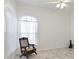 Bright living room with large windows and ceiling fan at 6730 Greenview Ln, Englewood, FL 34224