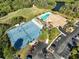 Aerial view of tennis courts, pool, and clubhouse at 6730 Greenview Ln, Englewood, FL 34224