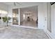 Sunroom with sliding doors opening to a view of the dining area at 6730 Greenview Ln, Englewood, FL 34224
