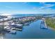 Aerial view of marina with boats, docks, and waterfront restaurant at 8888 Bay St, Placida, FL 33946