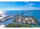 Aerial view of waterfront property with boat docks and parking area at 8888 Bay St, Placida, FL 33946