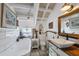 Charming bathroom with white subway tiles, a clawfoot tub, and a modern vanity at 8888 Bay St, Placida, FL 33946