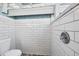 Small bathroom with white subway tiles and a shower stall at 8888 Bay St, Placida, FL 33946