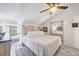 Light and airy bedroom with a white bed and mirrored closet doors at 8888 Bay St, Placida, FL 33946