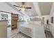 Main bedroom with a rustic wooden bed frame and a barn door at 8888 Bay St, Placida, FL 33946