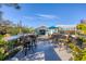 Relaxing deck overlooking the backyard with patio furniture at 8888 Bay St, Placida, FL 33946
