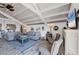 Spacious living room with vaulted ceilings and coastal decor at 8888 Bay St, Placida, FL 33946