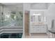 Spa-like bathroom with jacuzzi tub and double sinks at 9238 Melody Cir, Port Charlotte, FL 33981