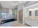 Bathroom boasts a large jacuzzi tub and double vanity at 9238 Melody Cir, Port Charlotte, FL 33981