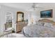 Bedroom with wicker furniture and coral bedding at 9238 Melody Cir, Port Charlotte, FL 33981