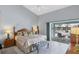 Main bedroom with pool access and sitting bench at 9238 Melody Cir, Port Charlotte, FL 33981