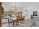 Formal dining room with wood table and chandelier at 9238 Melody Cir, Port Charlotte, FL 33981