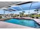 Inviting screened pool and spa with canal views at 9238 Melody Cir, Port Charlotte, FL 33981