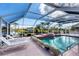 Relaxing pool area with canal views and lounge chairs at 9238 Melody Cir, Port Charlotte, FL 33981