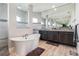 Bathroom features a soaking tub, walk-in shower, and dual vanity at 9533 Arnaz Cir, Port Charlotte, FL 33981