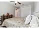 Bedroom boasts neutral walls, wood-look floors, white trim, and a ceiling fan at 9533 Arnaz Cir, Port Charlotte, FL 33981
