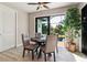 Dining area features a view of the pool and backyard at 9533 Arnaz Cir, Port Charlotte, FL 33981