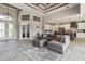 Spacious open-concept living area with wood-look floors and a seamless connection to the kitchen at 9533 Arnaz Cir, Port Charlotte, FL 33981