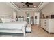 Bright main bedroom features a tray ceiling and neutral decor at 9533 Arnaz Cir, Port Charlotte, FL 33981