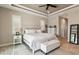 Bright main bedroom features a tray ceiling and neutral decor at 9533 Arnaz Cir, Port Charlotte, FL 33981